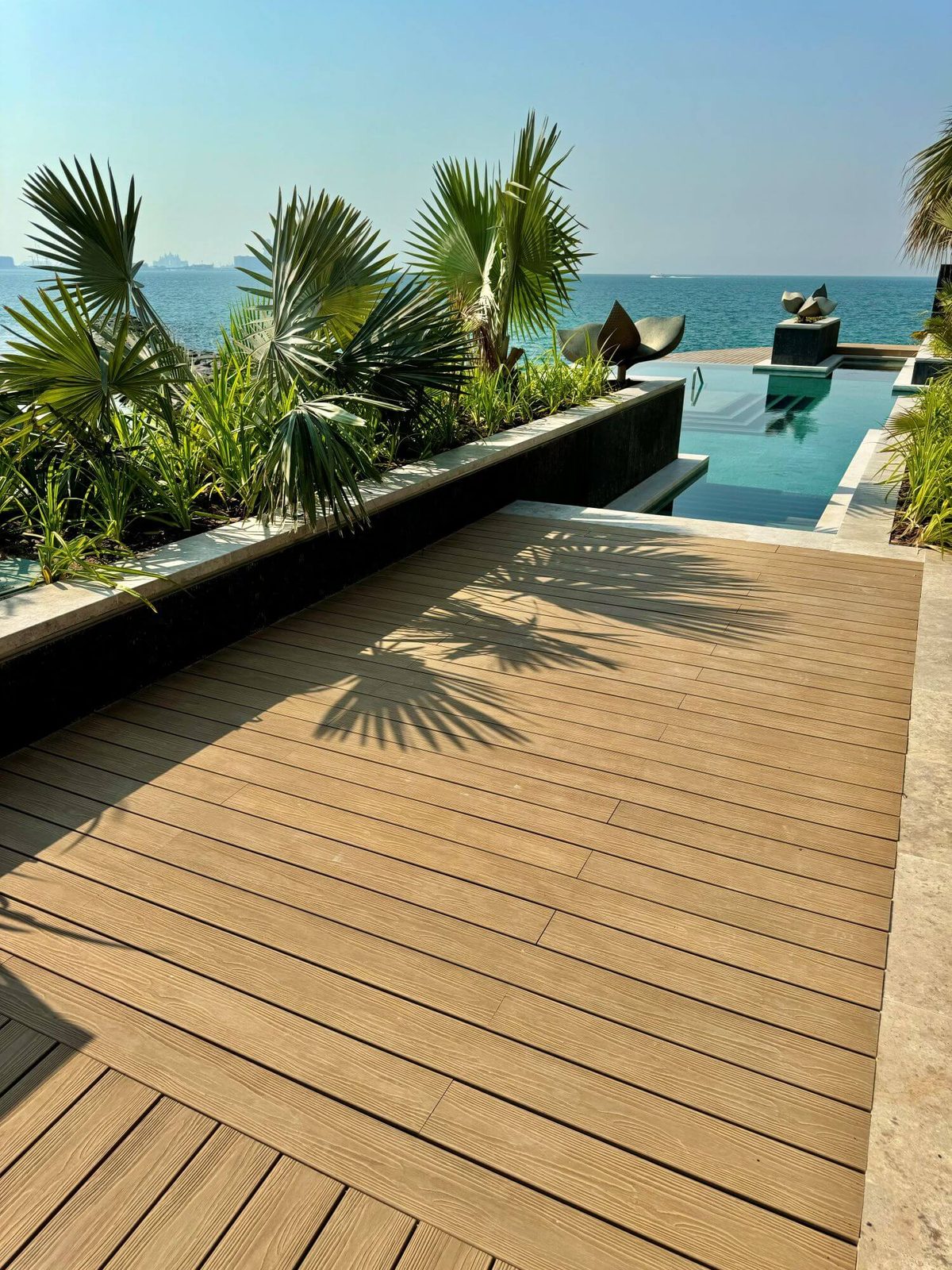 accessible-decking-for-architects The Shark clip lifts one board out and puts it back with a single tool, leaving the joists untouched and the deck reading exactly as it did before.